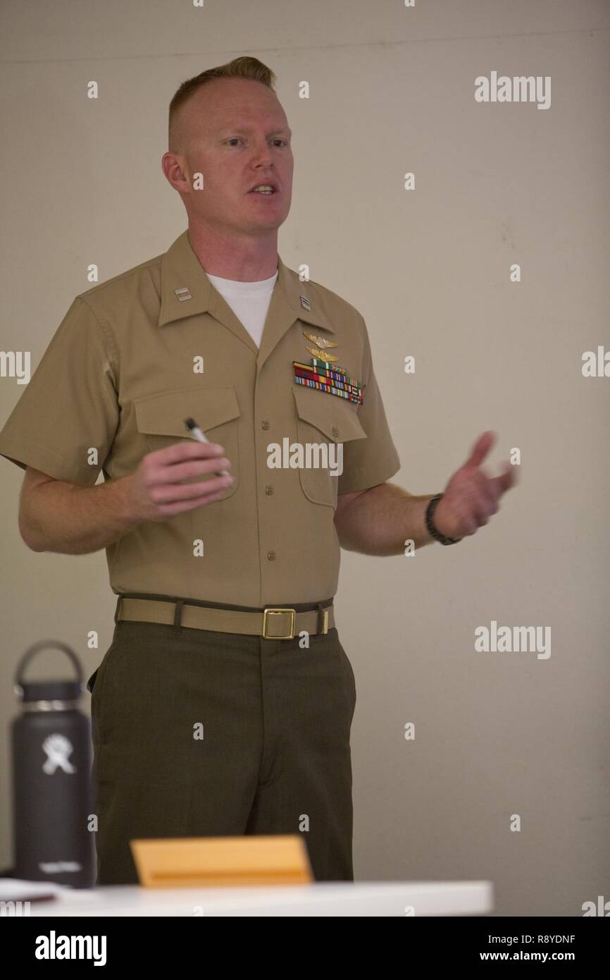 U.S. Marine Capt. Scott L. Campbell, maintenance officer with Marine Aviation Weapons and Tactics Squadron One (MAWTS-1) welcomes students attending the first ever Advanced Aircraft Maintenance Officer Course (AAMOC) at Marine Corps Air Station Yuma, Ariz., on Mar. 13, 2017. AAMOC will empower Aircraft Maintenance Officers with leadership tools, greater technical knowledge, and standardized practices through rigorous academics and hands on training in order to decrease ground related mishaps and increase sortie generation. Stock Photo