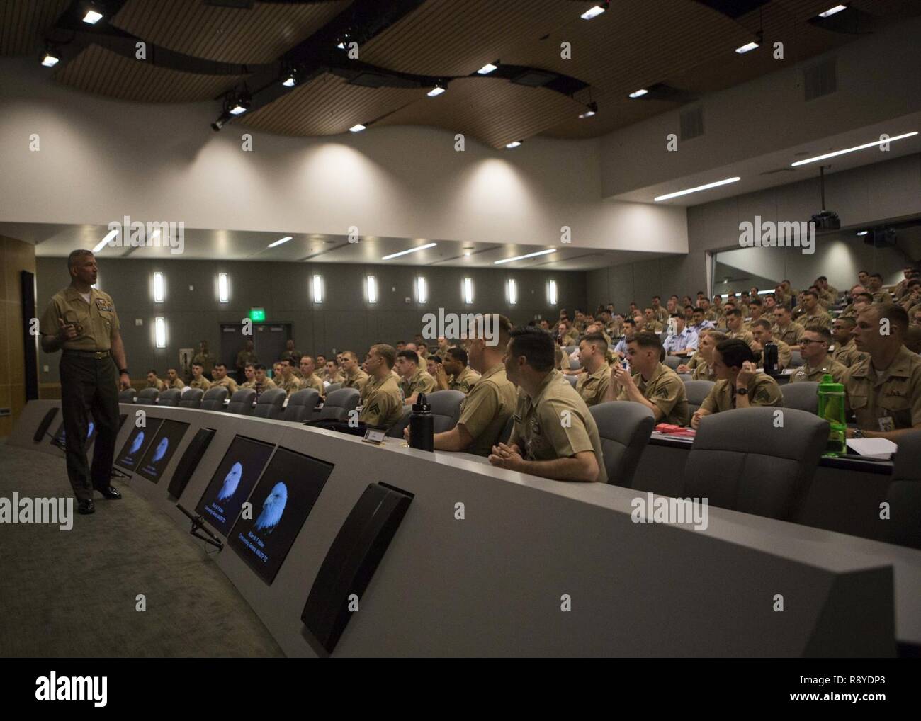 U.S. Marine Brig. Gen. William F. Mullen III, commanding general of Marine Air Ground Task Force Training Command (MAGTFTC), welcomes students attending Weapons and Tactics Instructor (WTI) course 2-17 at Marine Corps Air Station Yuma, Ariz., Mar. 13, 2017. WTI is a seven week training event hosted by MAWTS-1 cadre. MAWTS-1 provides standardized advanced tactical training and certification of unit instructor qualifications to support Marine Aviation Training and Readiness and assists in developing and employing aviation weapons and tactics. Stock Photo