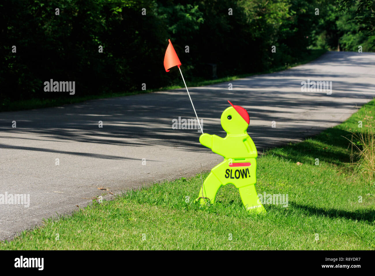 Amusing road sign in the shape of a turtle to slow down drivers Stock Photo