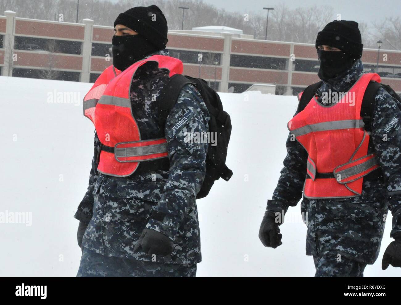 GREAT LAKES Il. Mar. 13 2017 Road guards march during inclement weather Mar. 13 at Recruit Training Command. Recruits march on base from event to event regardless of weather conditions outside of