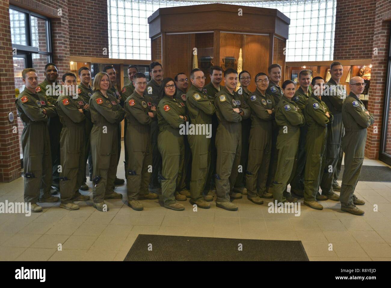 Twenty-two members of the 91st Operations Group pose for a photo at ...