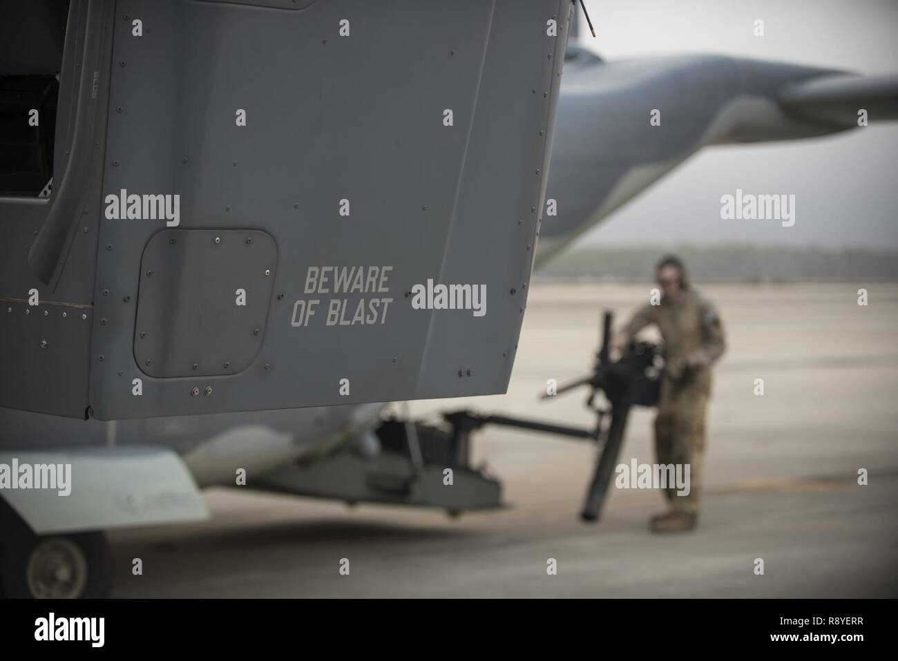A U.S. Air Force flight engineer with the 8th Special Operations Squadron checks the functionality of a CV 22 Osprey s machine gun Feb. 27 2017 at Hurlburt Field Fla. The aircraft flew in