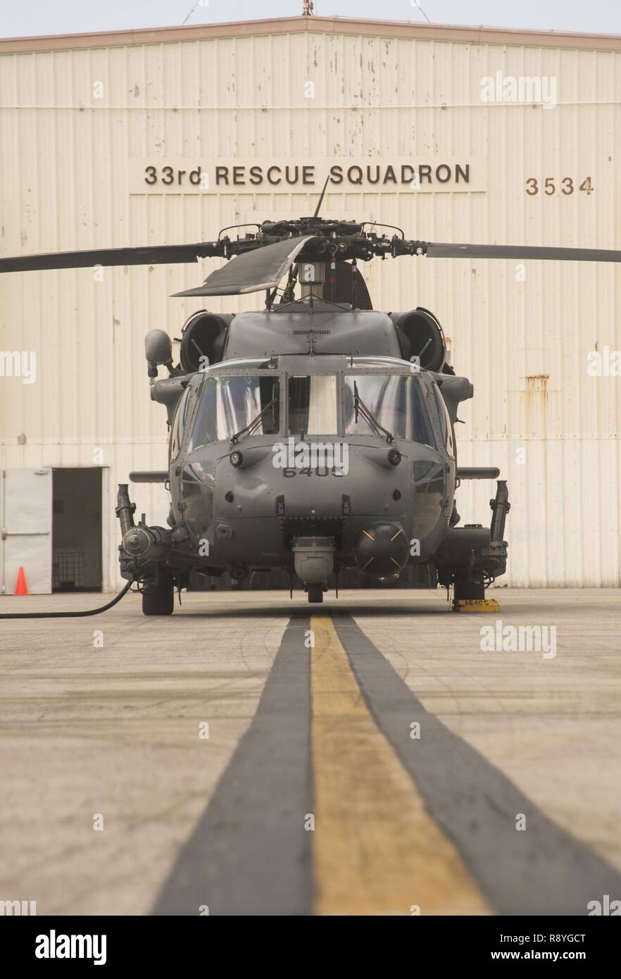 A HH-60G Pave Hawk sits on display outside the 33rd Rescue Squadron March 15, 2017, at Kadena Air Base, Japan. As part of a week of joint-service professional military education, the Airmen of Kadena demonstrated what the Air Force brings to the fight. Stock Photo