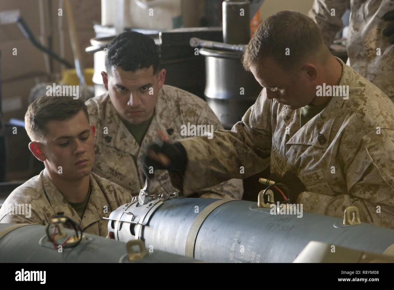 U.S. Marines with various Marine Aviation Logistics Squadrons (MALS) give a period of instruction on the Guided Bomb Unit 38 (GBU-38) during the first ever Aircraft Maintenance Officer Course (AAMOC) at Marine Corps Air Station Yuma, Ariz., March 17, 2017. AAMOC will empower Aircraft Maintenance Officers with leadership tools, greater technical knowledge, and standardized practices through rigorous academics and hands on training in order to decrease ground related mishaps and increase sortie generation. Stock Photo