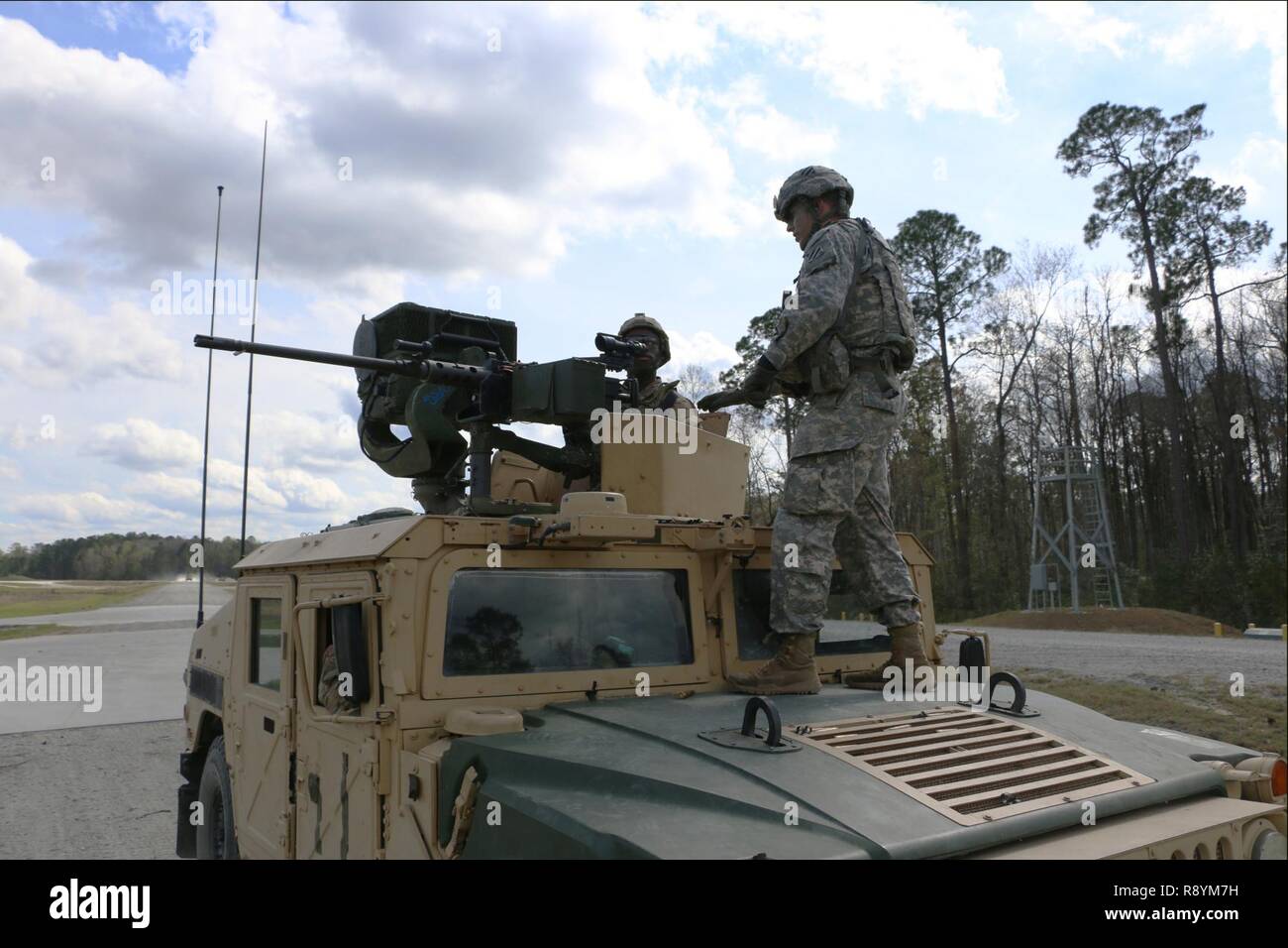 2nd Lt. Matthew Miller, assistant operations officer with 6th Squadron, 8th Cavalry Regiment, 2nd Infantry Brigade Combat Team, 3rd Infantry Division, clears an M2 .50 caliber machine gun during a mounted gunnery range March 8, 2017 at Fort Stewart, Ga. 6-8 Cav. Soldiers qualified with mounted weapons in preparation for a squadron field training exercise next month. Stock Photo