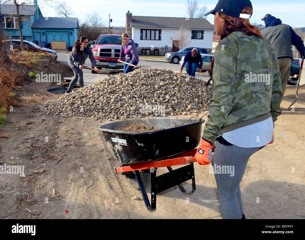 A team of women from Ellsworth Air Force Base landscape a Habitat for