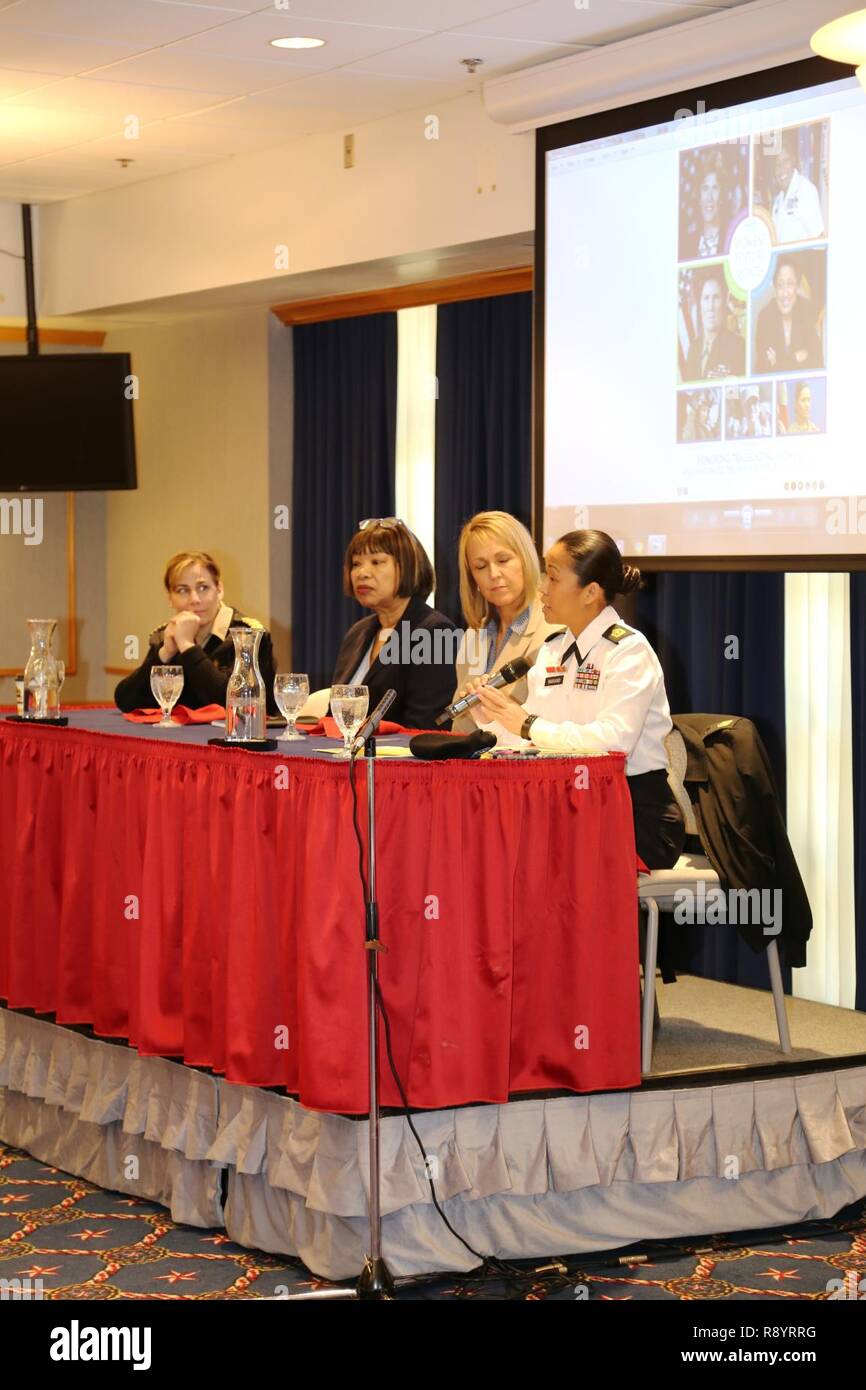 A guest speaker panel comprising (left to right) Capt. Kimberly Elenberg with the U.S. Public Health Service at the Pentagon, Pastor Ethell Tillis with the Tomah (Wis.) Pentecostal Assembly, Lori Freit-Hammes with the Mayo Clinic Health System-Franciscan Healthcare in La Crosse, and 1st Sgt Leah Mariano with the Staff Sgt. Todd R. Cornell Noncommissioned Officer Academy participates in the installation observance of Women’s History Month on March 16, 2017, at McCoy’s Community Center at Fort McCoy, Wis. Dozens of people attended the event to learn more about each panel member’s history and hea Stock Photo