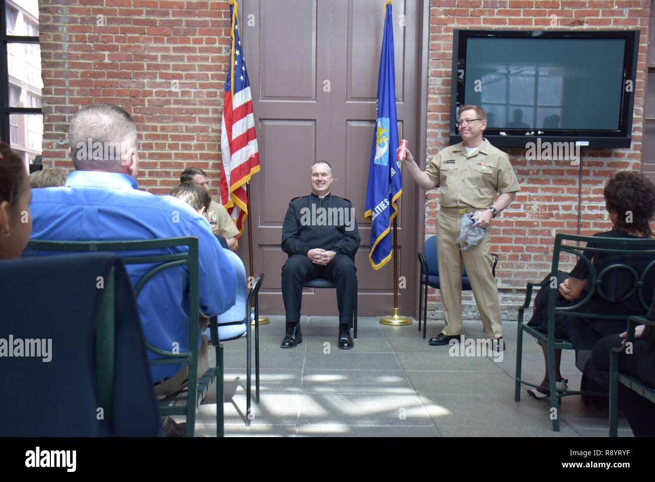 Cmdr. Michael Luken takes the Navy officer promotion oath of office