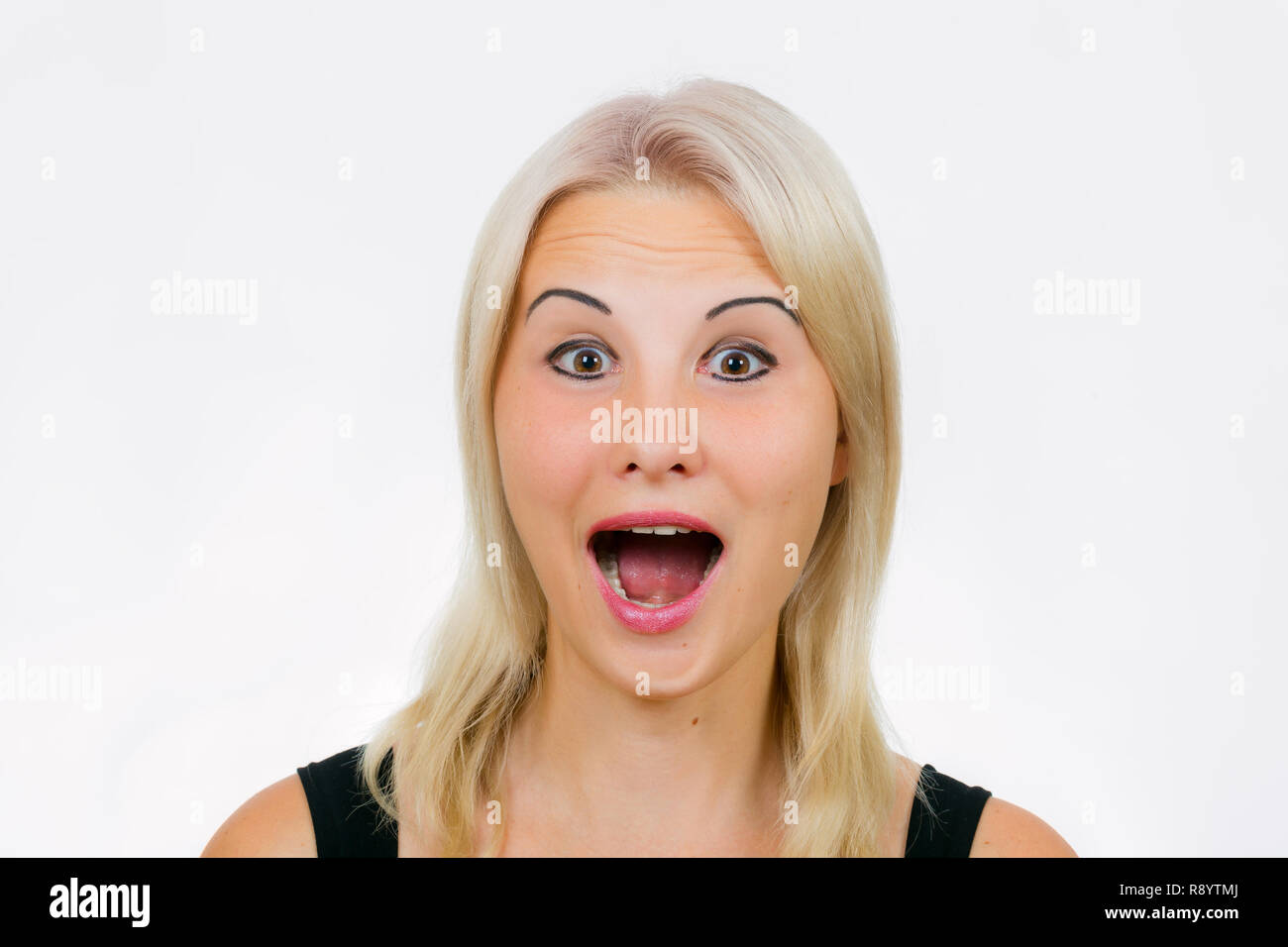 Face exercises, funny female face expression, surprised face with open