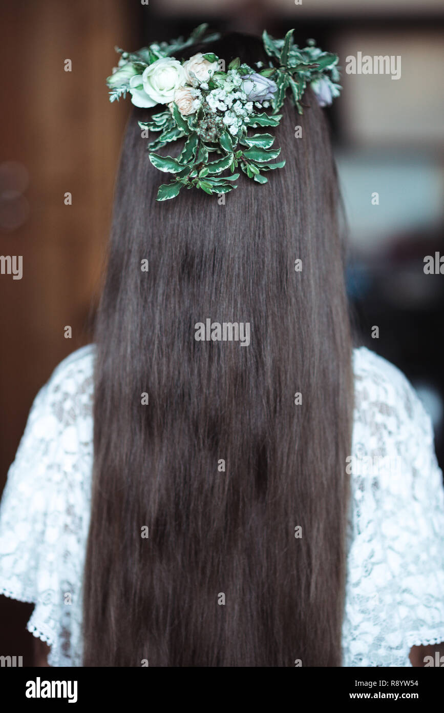 cute girl with very long hair and a beautiful wreath of flowers on her ...