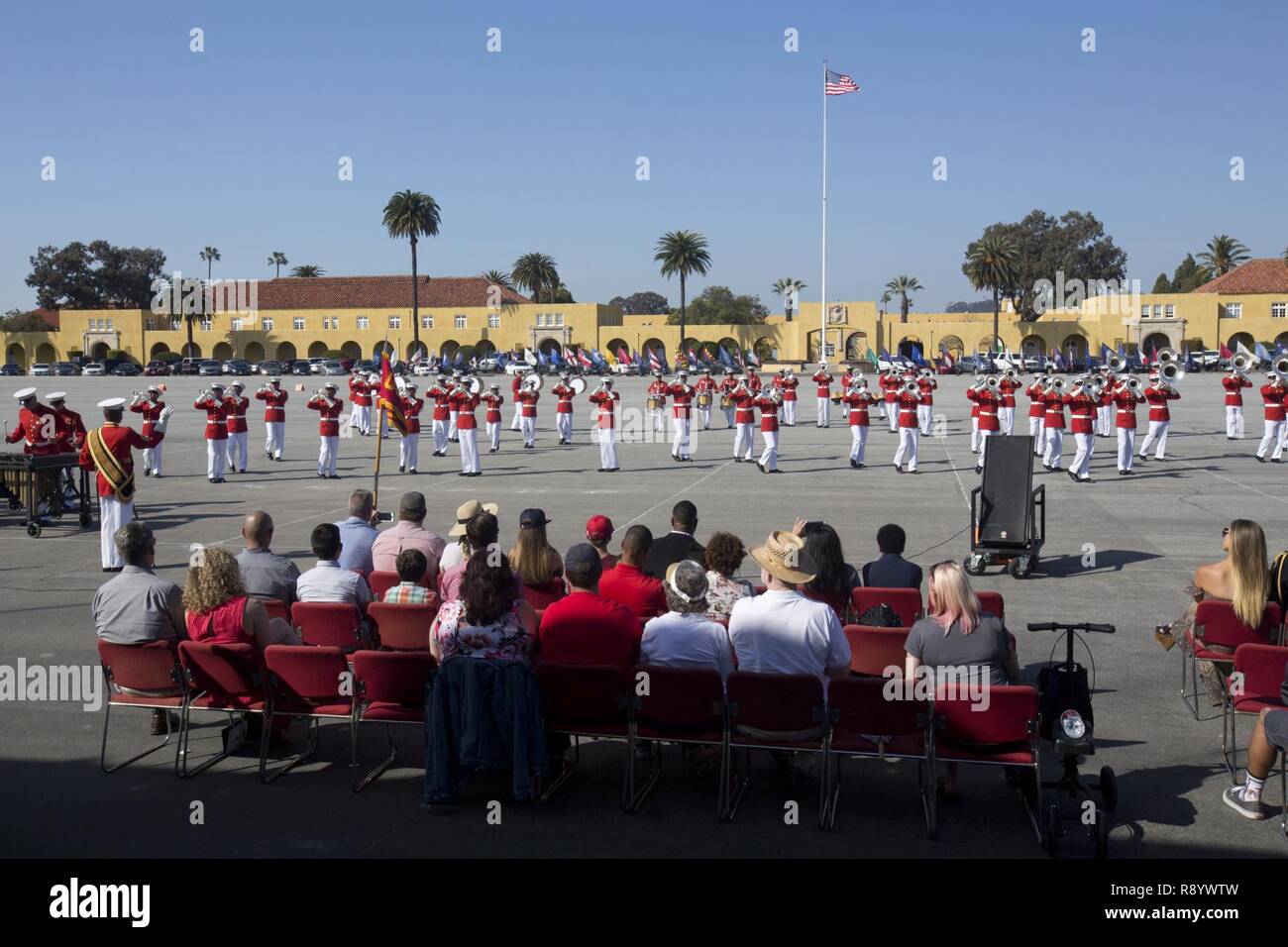 U.S. service members, friends, and family attend a Battle Color ceremony at Marine Corps Recruit Depot San Diego, Calif., March 11, 2017. The ceremony included a performance by the Marine Drum and Bugle Corps, the Silent Drill Platoon, and the Marine Corps Color Guard. Stock Photo