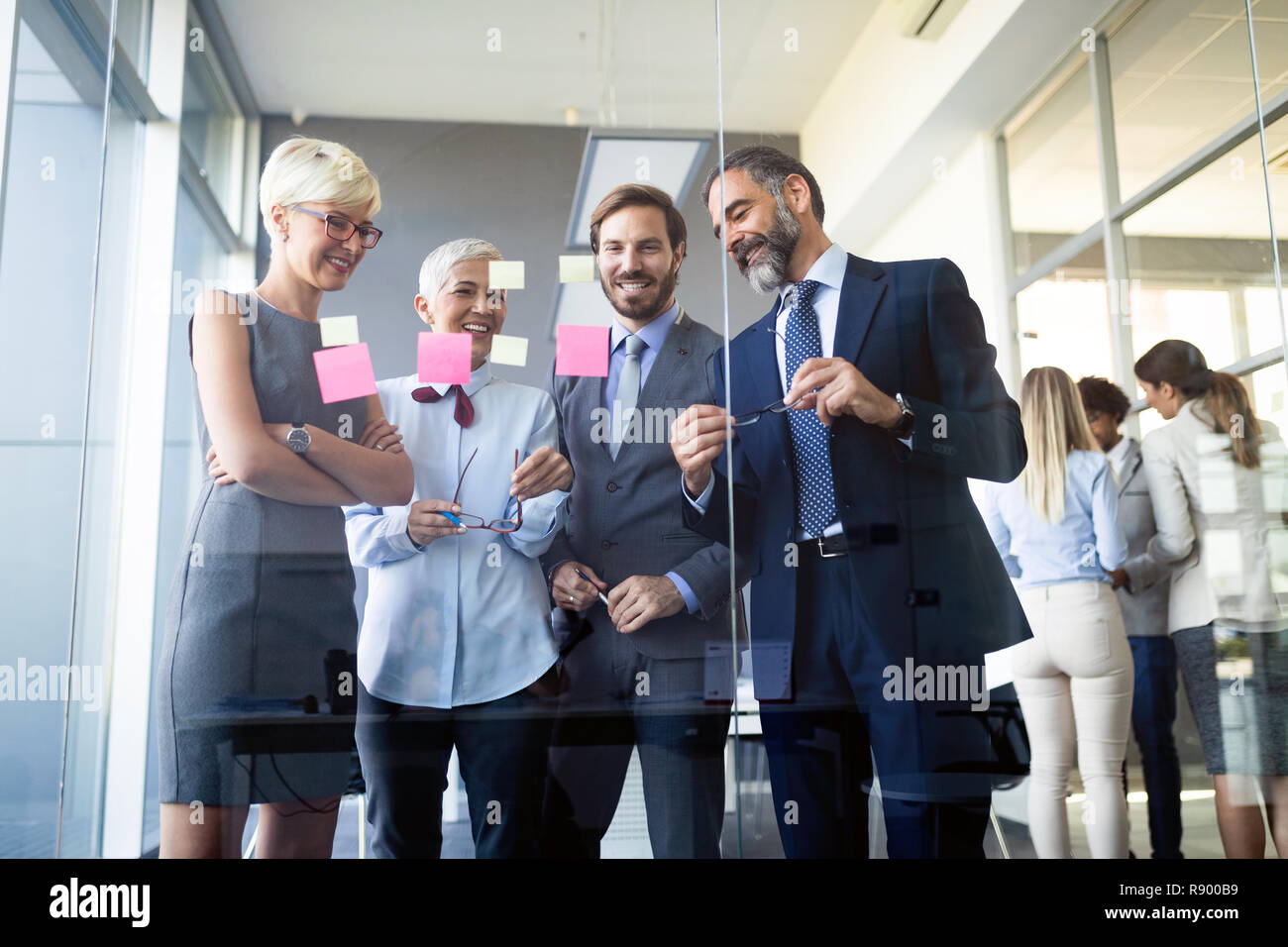 Group young businessmen informal meeting hi-res stock photography and ...