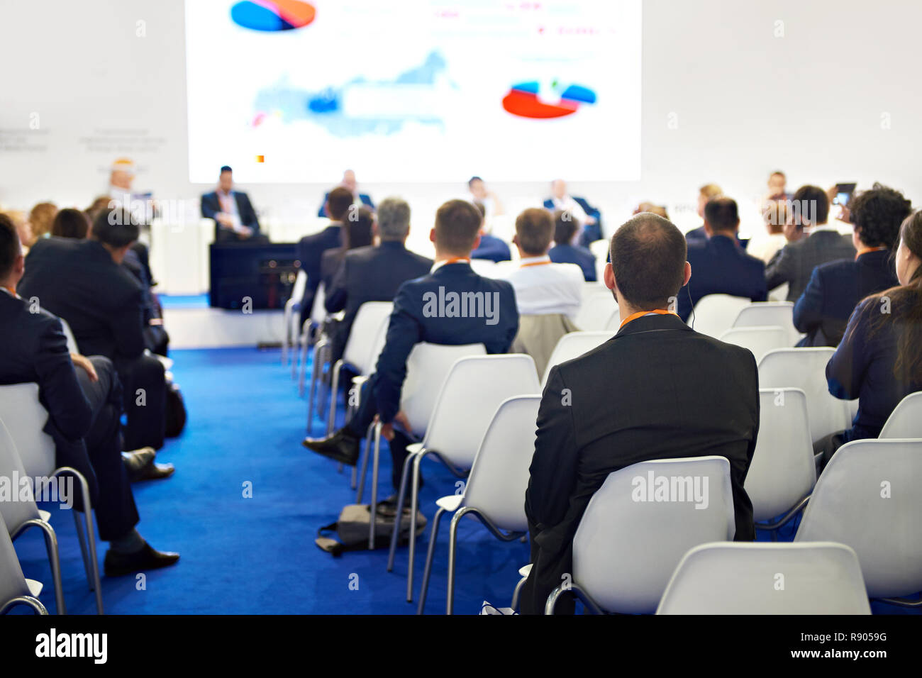 Business conference and visitors. Back view Stock Photo