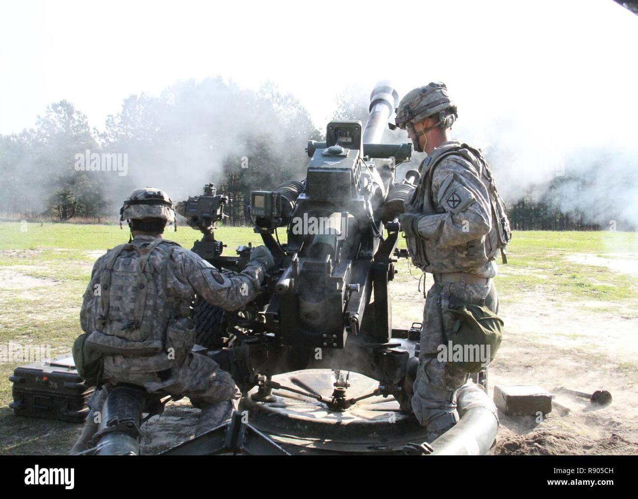 Artillerymen with the 3rd Battalion, 6th Field Artillery Regiment, fire