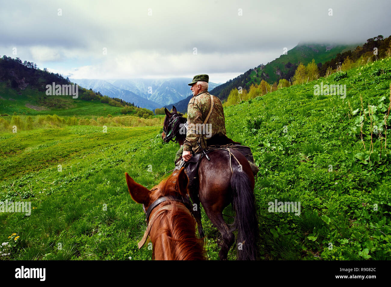 Krasnodar, RUSSIA - July 17, 2015: Huntsman is a horse in the mountains. Stock Photo