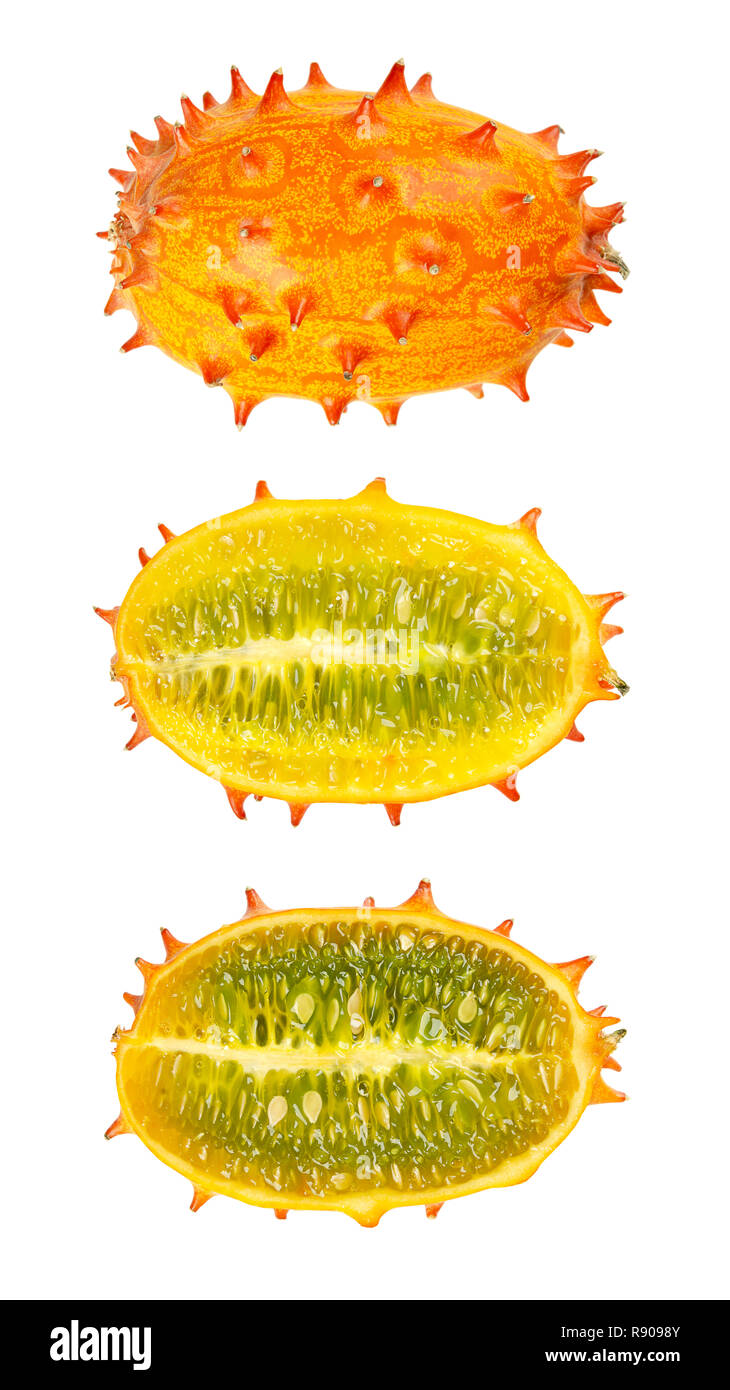 Kiwano, horned melon, whole and half fruit isolated over white. African horned cucumber, jelly melon, hedged gourd or melano. Stock Photo
