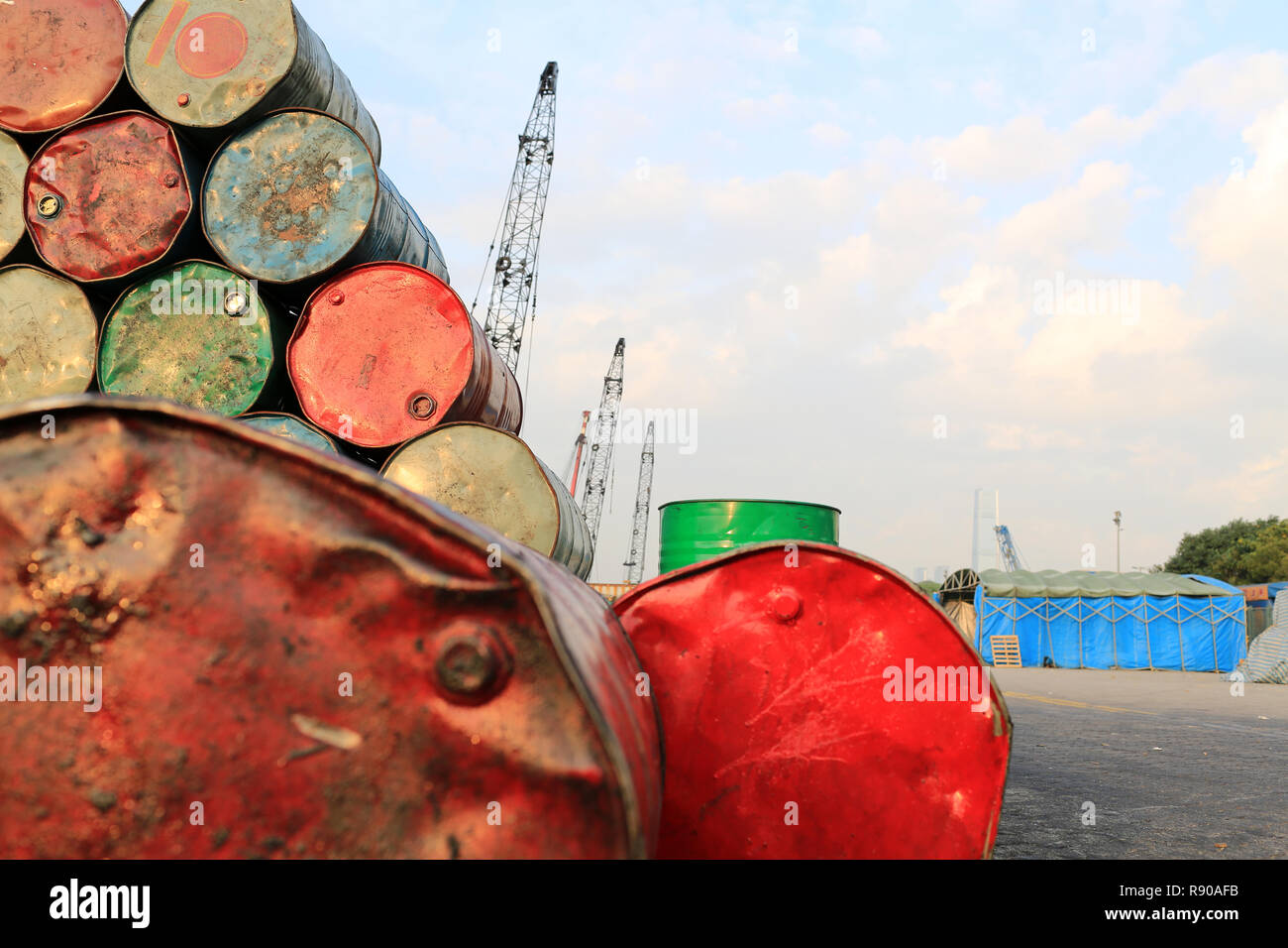 old red oil barrell in the dock background crude oil price in hong kong china Stock Photo