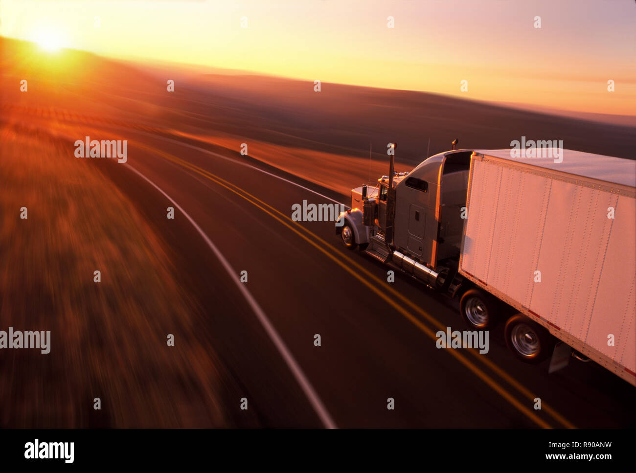Kenworth W900 Class 8 truck on highway in south eastern Washington state at sunrise. Hwy 129