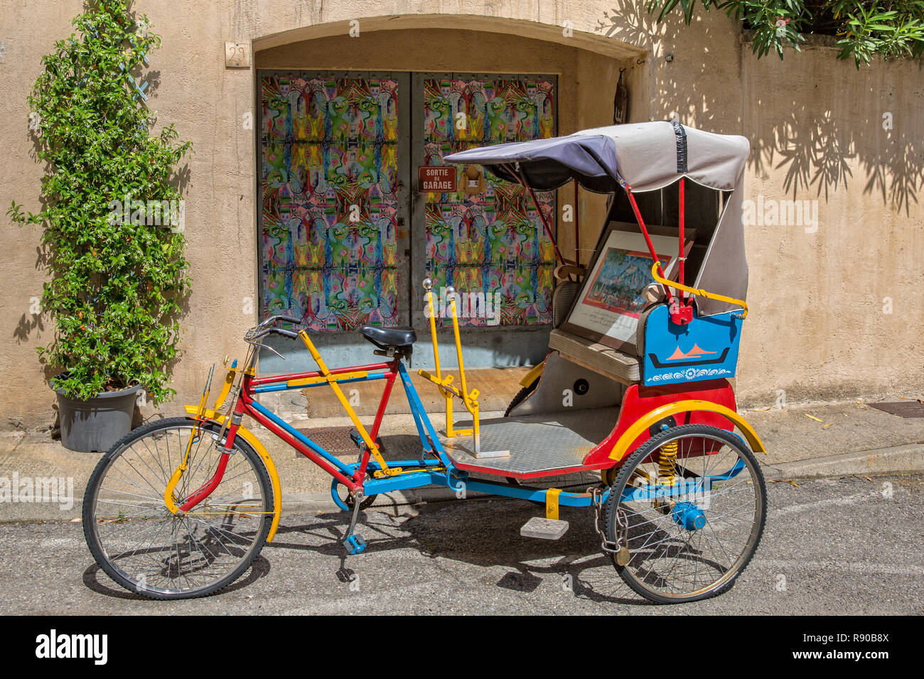 Lourmarin, Provence, France - Mai 30, 2017: Close-up of a colorful rickshaw in a street of Lourmarin, Luberon, Vaucluse Stock Photo
