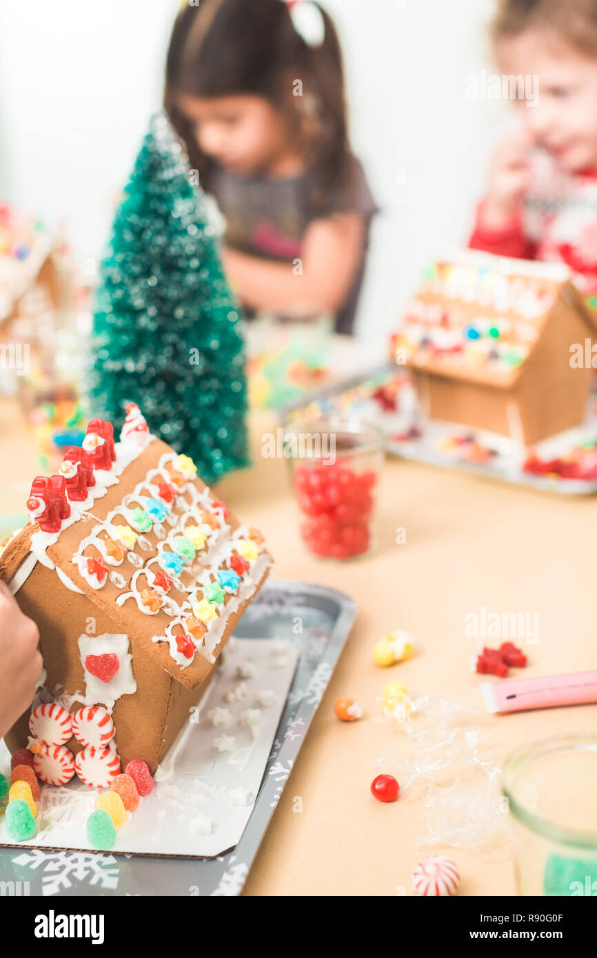 Download Kids Decorating Small Gingerbread Houses At The Christmas Craft Party Stock Photo Alamy PSD Mockup Templates