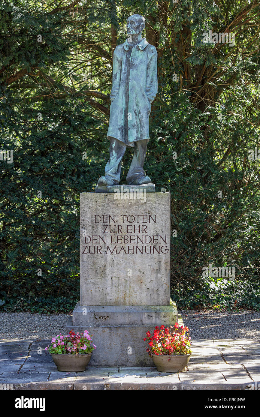 Viewed here is the bronze statue of the Unknown Prisoner, set in the grounds of Dachau Concentration Camp in Germany. Stock Photo
