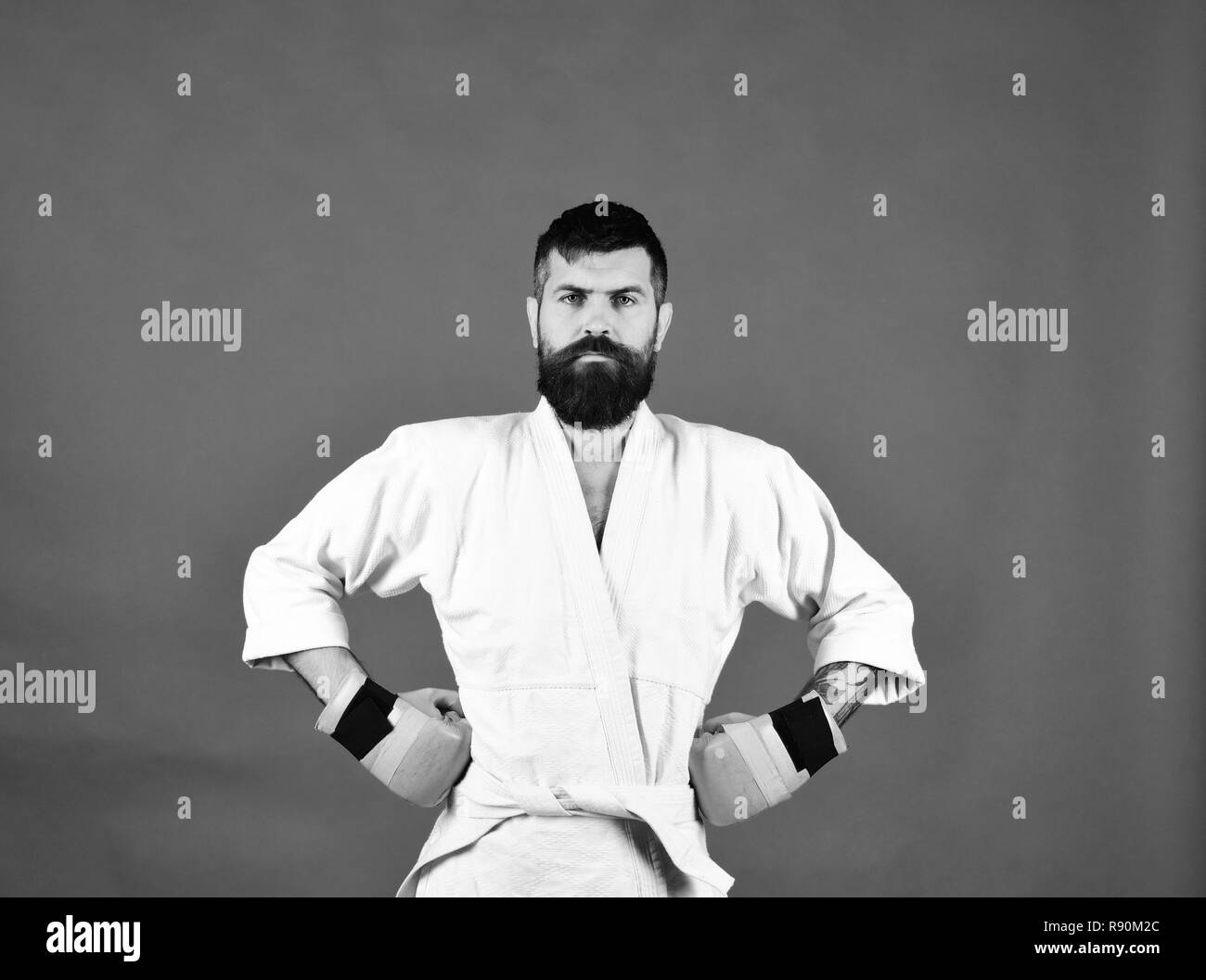 Combat master poses demonstrating muscles. Japanese martial arts