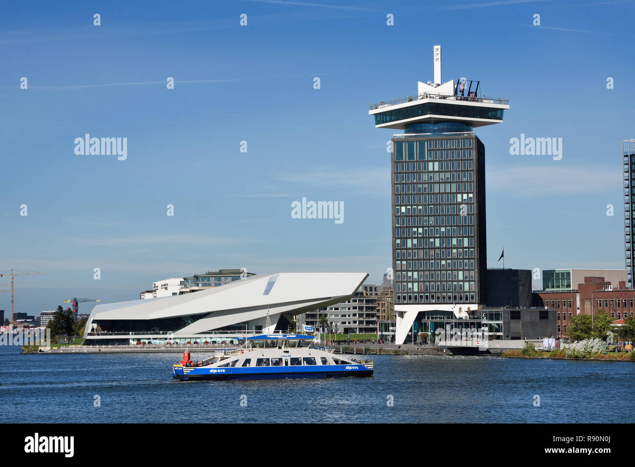 Waterfront of Amsterdam Noord district with modern building of EYE Film Institute and Amsterdam Tower The Netherlands, (North bank of the IJ) Stock Photo