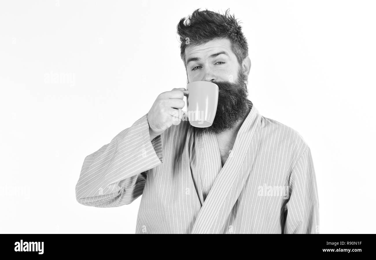 Man with beard and mustache holds mug of coffee, isolated on white