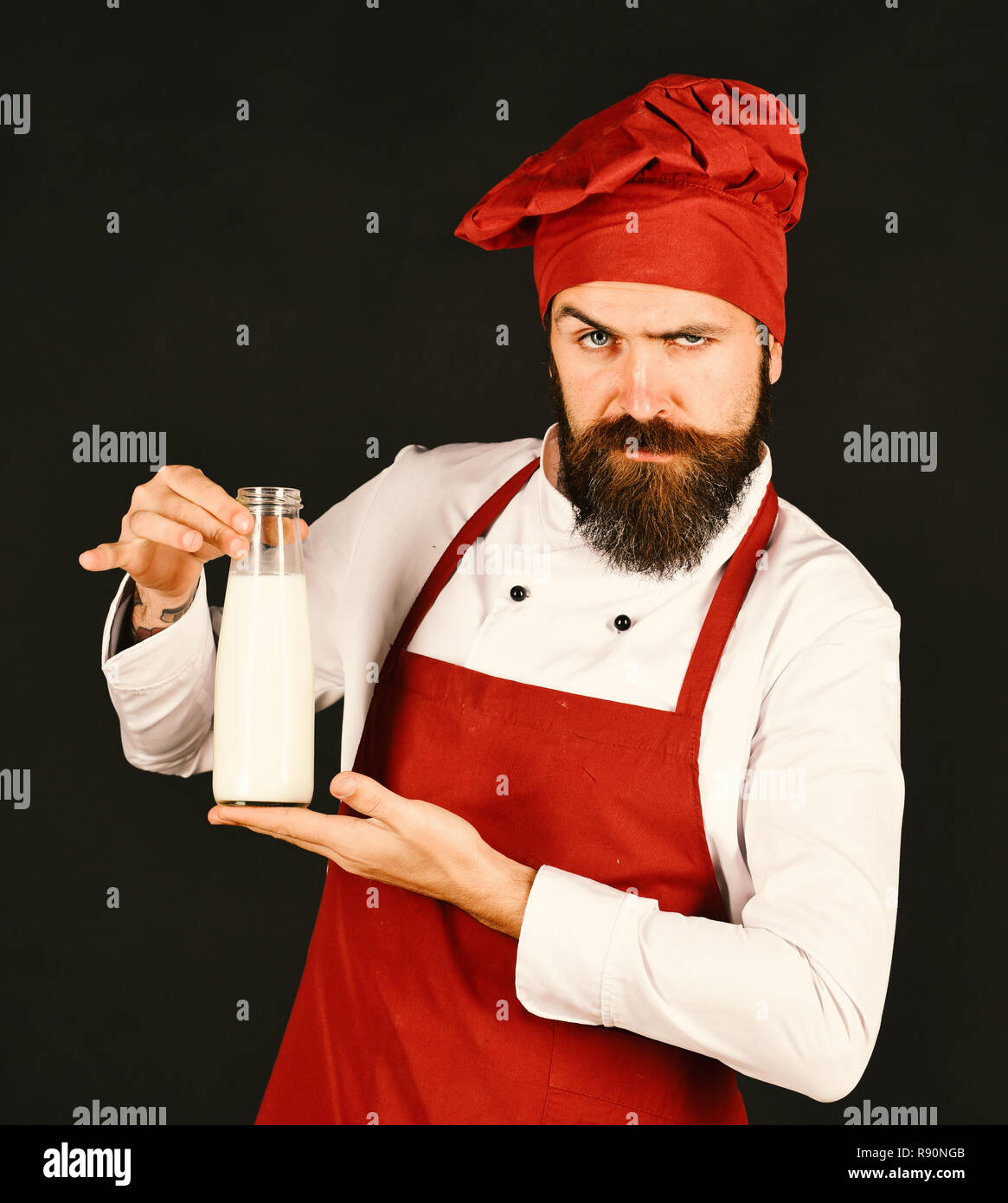 Chef with milkshake or yoghurt. Protein diet concept. Cook with