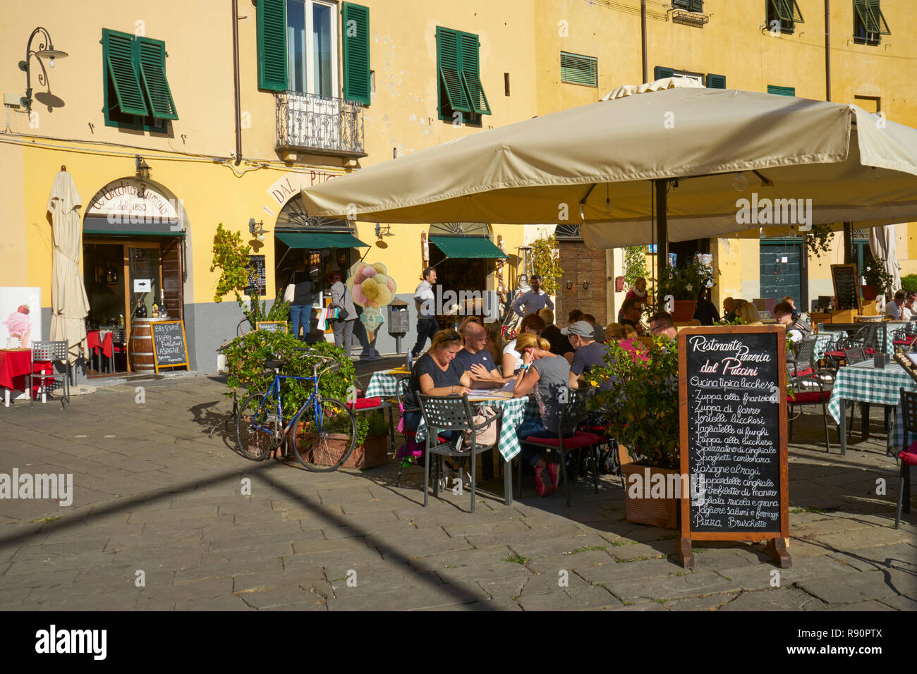 Lucca, Italy: Restaurant in Piazza Anfiteatro, an old Roman amphitheatre Stock Photo