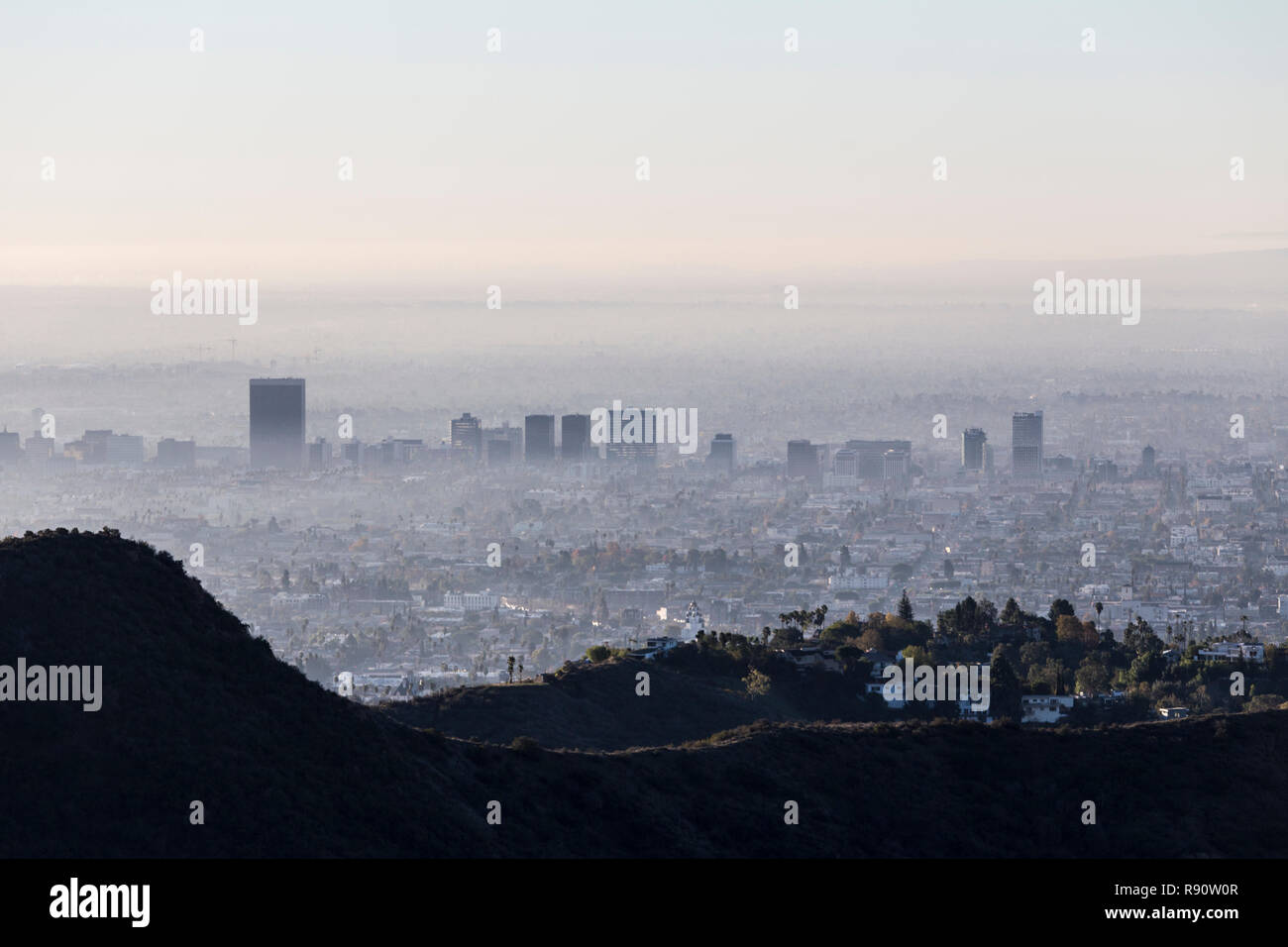 Foggy, smoggy morning skyline view of Los Angeles Mid City from popular Griffith Park near Hollywood, California. Stock Photo