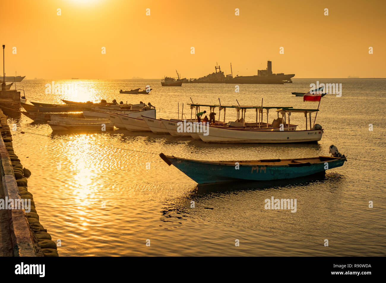 Boats in the harbor of Berbera Somaliland Somalia at sunset Stock Photo