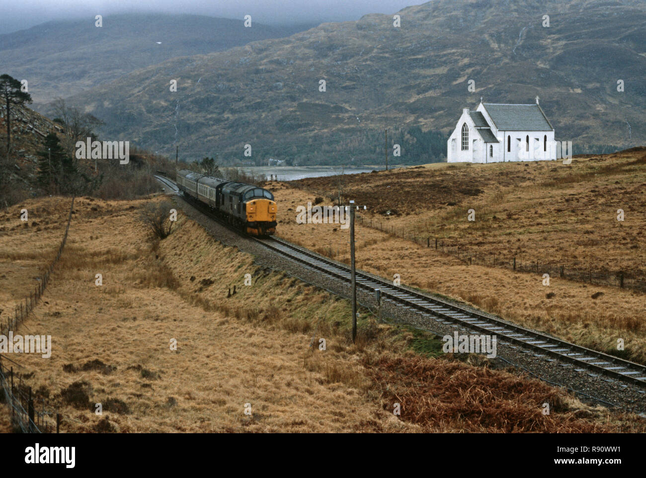 Diesel Locomotive Passing In Front Of Lady Of The Braes Roman