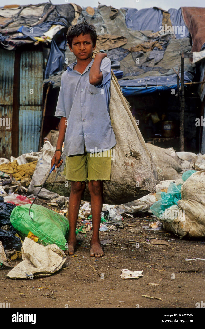 rag picker boy and garbage, bombay mumbai, maharashtra, india Stock