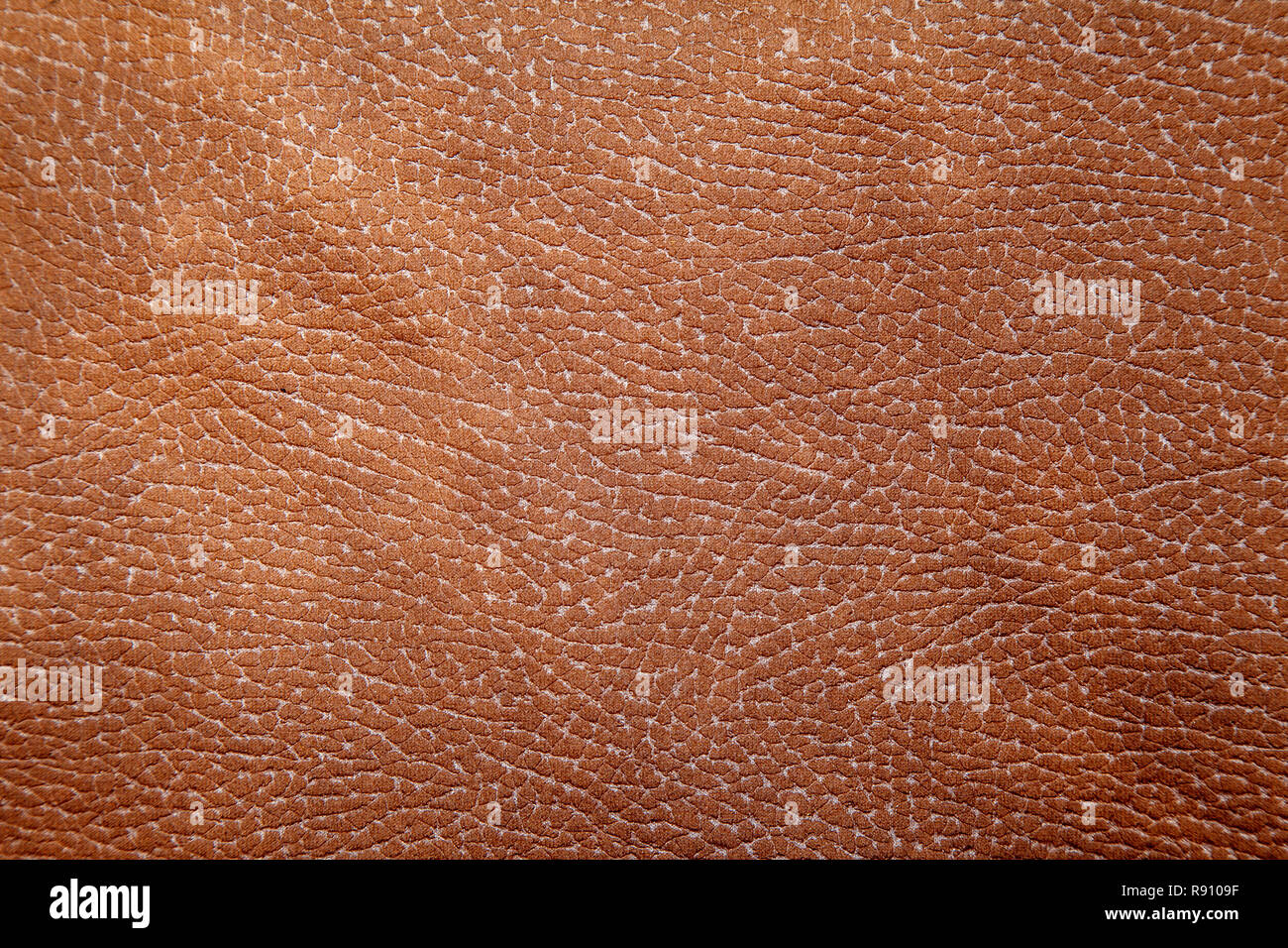 bright red leather upholstery for furniture as background indoor