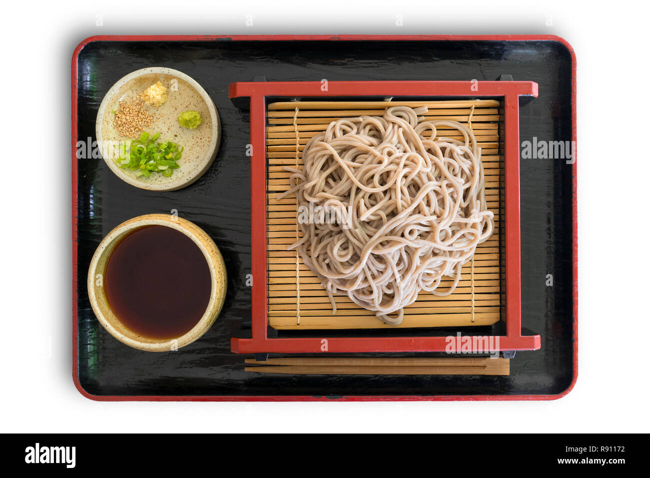 Tray with a traditional Japanese meal with cold soba noodles, sauce and