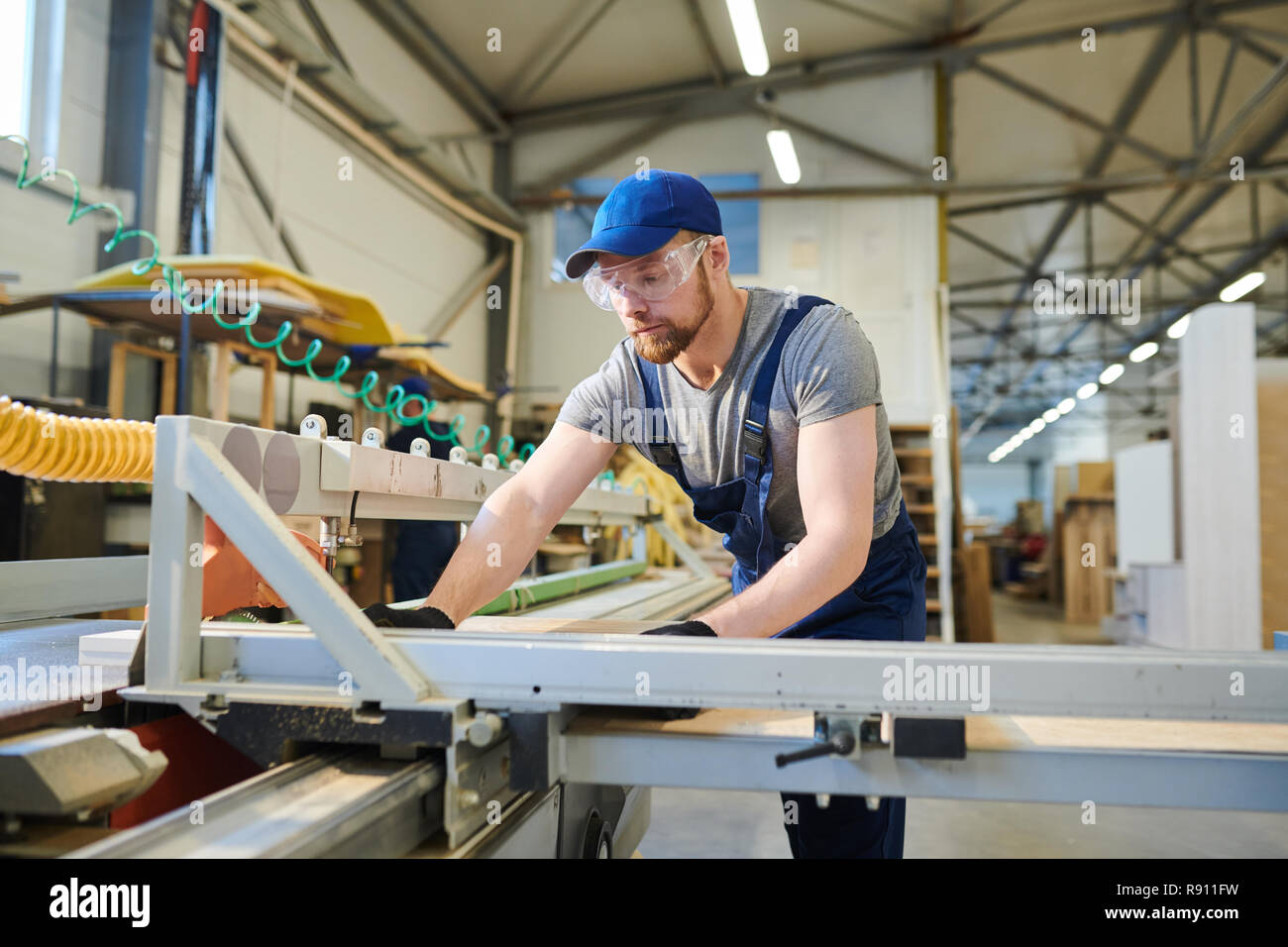 Concentrated engineer joining furniture details Stock Photo Alamy