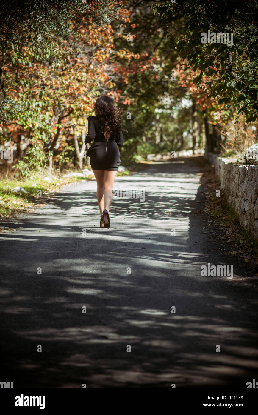 Woman run rear view dress hi-res stock photography and images - Alamy