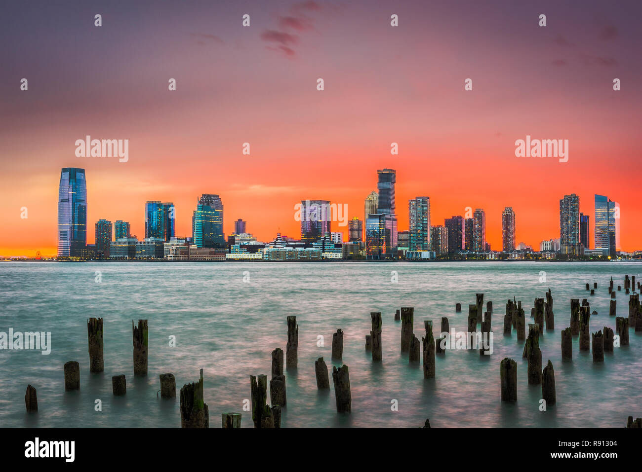 Jersey City, New Jersey, USA skyline across the Hudson River after sunset. Stock Photo