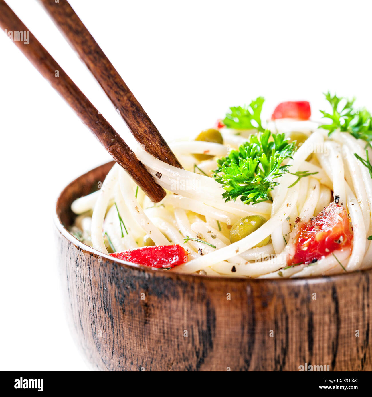Chopsticks with Vegetarian noodles on white background Stock Photo