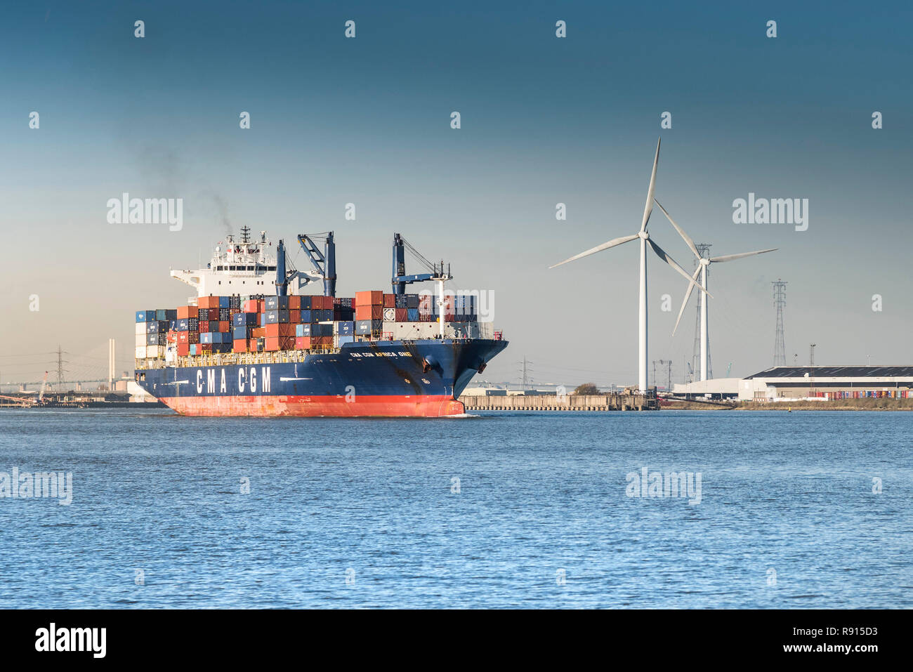 Shipping on the Thames.  The CMA CGM Africa One container ship leaving the Port of Tilbury and steaming downriver on the River Thames. Stock Photo