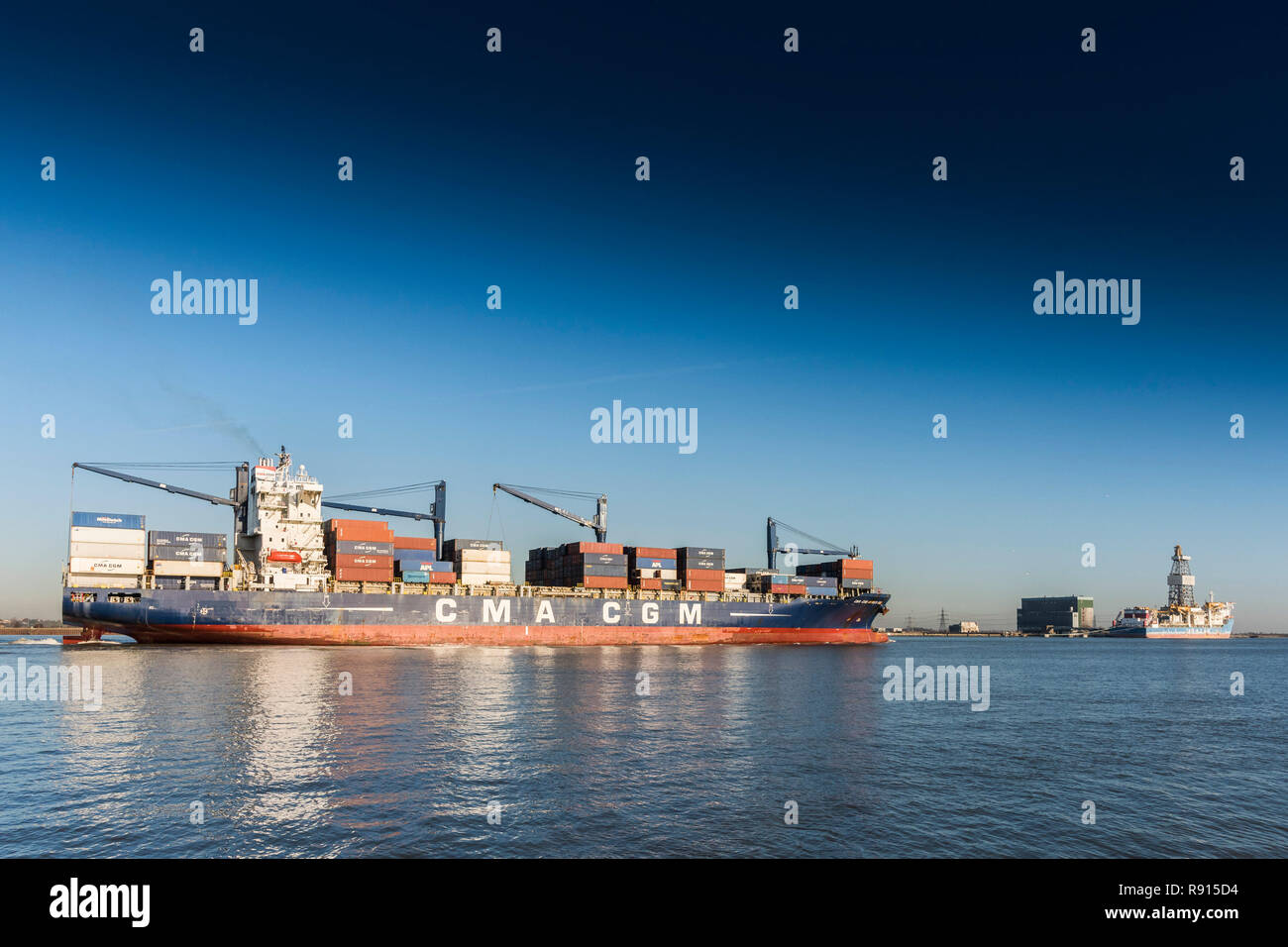 Shipping on the Thames.  The CMA CGM Africa One container ship lteaming downriver on the River Thames. Stock Photo