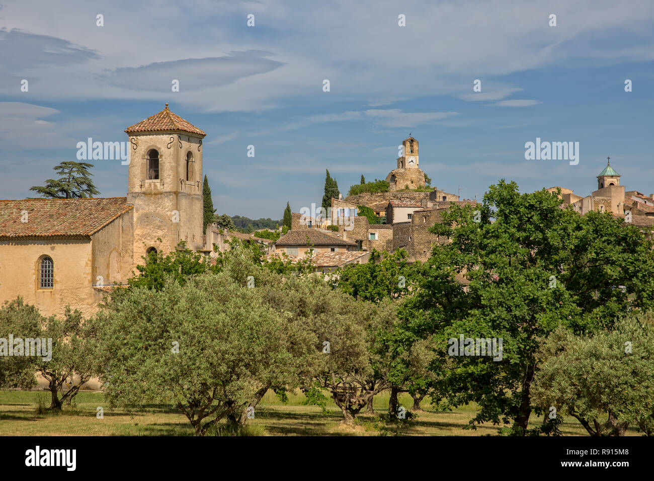 Belfry of the Protestant Church and Clock Tower in the idyllic village of Lourmarin, Provence, Luberon, Vaucluse, France Stock Photo