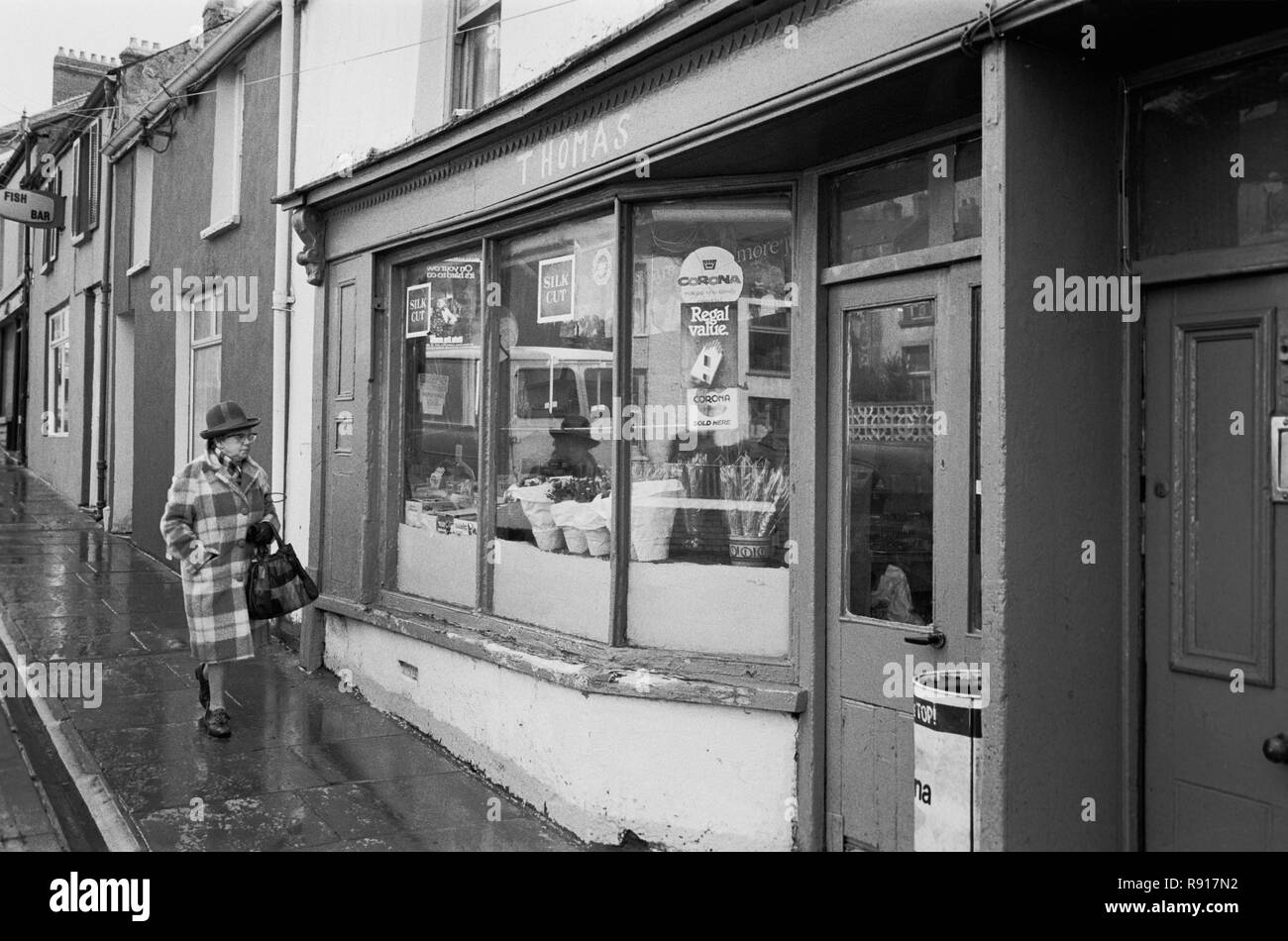 Woman out shopping in Dowlais, Merthyr Tydfil, Mid Glamorgan, South Wales, 1983 Stock Photo