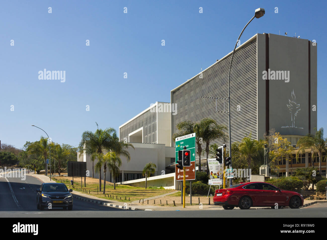 Windhoek municipal offices in central Windhoek Namibia with car at traffic lights at intersection of road Stock Photo