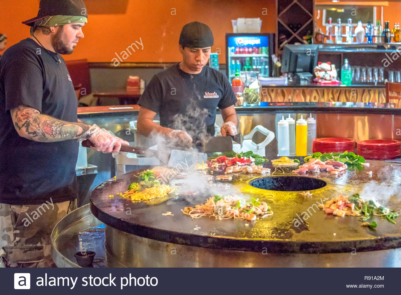 Mongolian Buffet Restaurant Kitchen Scenes In New York City Men Cutting Vegetables On A Large Circular Hot Pan At A Restaurant In Nyc Stock Photo Alamy