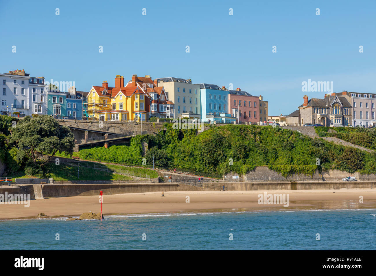 Colourful houses above the harbour and North Beach in Tenby, a walled seaside town in Pembrokeshire, south Wales coast, western side of Carmarthen Bay Stock Photo