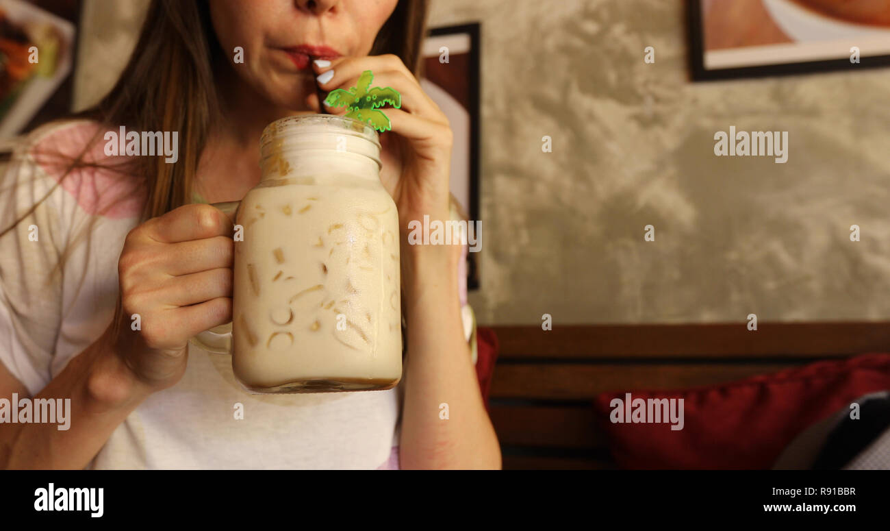 Crop female drinking healthy beverage Stock Photo