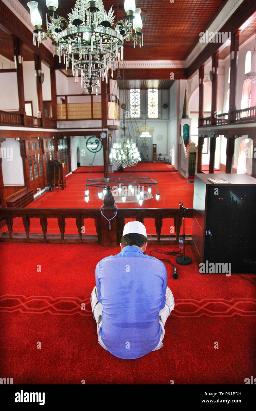 Man praying at Mosque in Istanbul, Turkey. Stock Photo