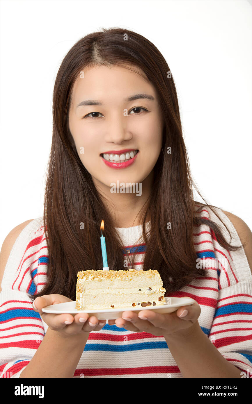 Beautiful Asian woman holding a birthday cake isolated on a white background Stock Photo Alamy